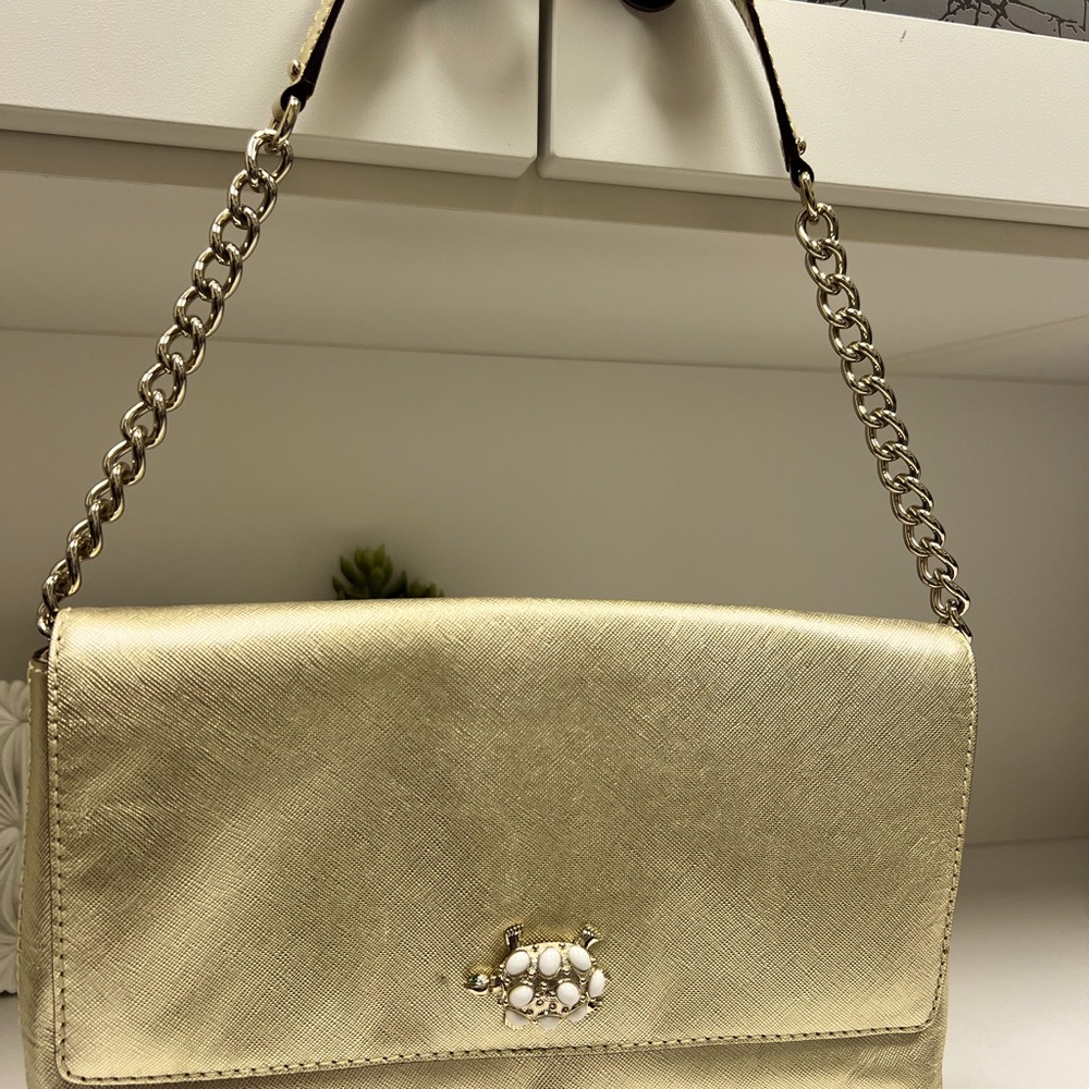 Kate Spade like new with no stains or scratches.